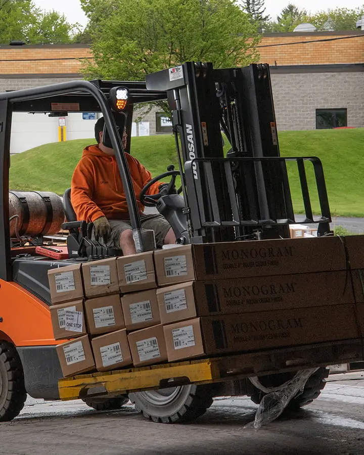 Worker operating a forklift