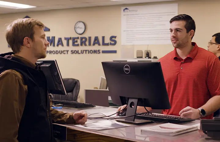 Employee assisting a customer at a counter